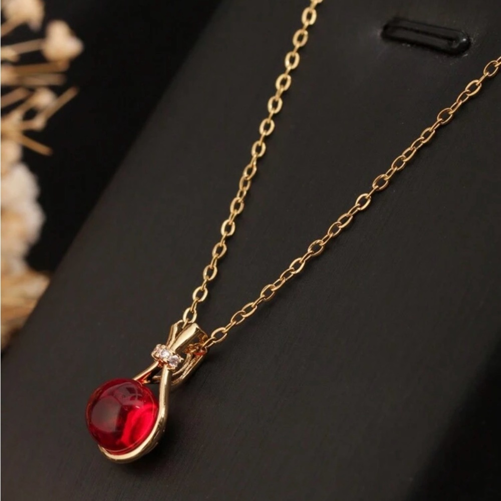 Elegant Gold Necklace with Red Pendant